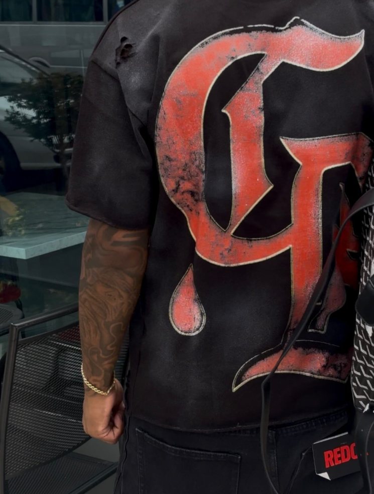 The Drip G print: a big red graffiti G with paint dripping off it